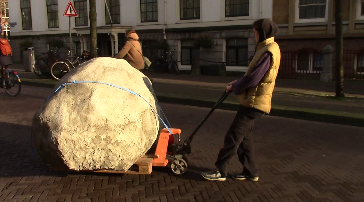 screenshot of video documentation of the tranportation of the rock